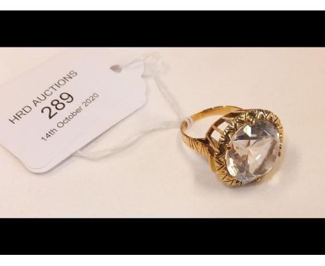 A large silver topaz ring in 18ct gold setting 