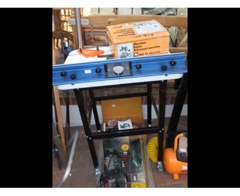 A router table with User Manual, together with a boxed router CONDITION REPORTWe have attached a number of additional images 
