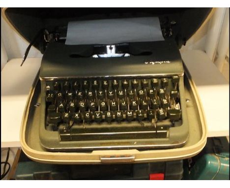 A cased vintage Olympia typewriter
