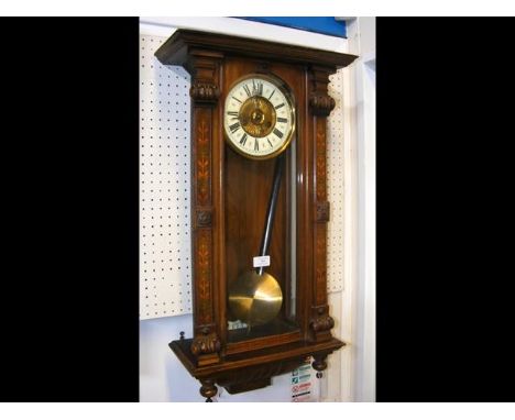 A Vienna style wall clock with striking movement 