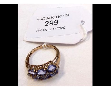A lady's purple stone dress ring in 9ct gold setting 
