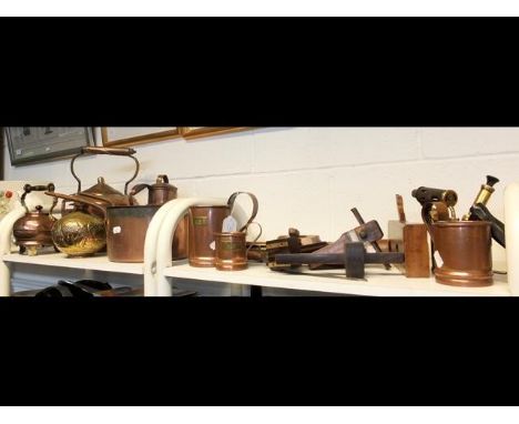 A selection of vintage and other copper together with woodworking planes - on two shelves