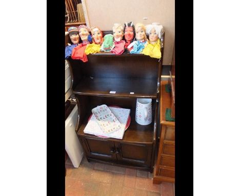 An Ercol style open side cabinet with cupboards under - width 60cms