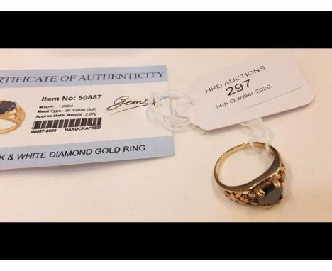 A black diamond Solitaire ring in 9ct gold setting - with Certificate 