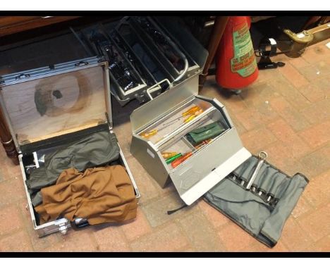 Three tool cases containing assorted tools