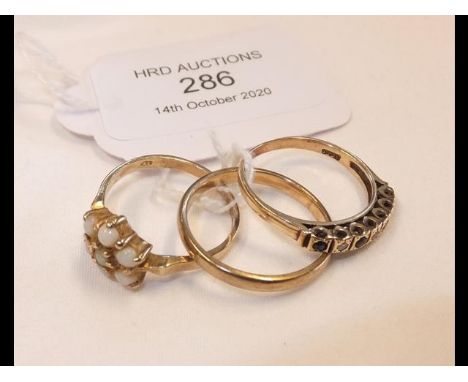 Two ladies dress rings, together with a gold wedding band CONDITION REPORTWedding band, size Q/RStone ring, size OCluster rin