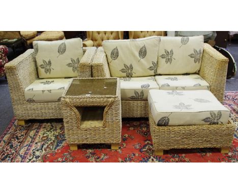 A woven rattan conservatory suite comprising two seat sofa, armchair, pouffe and table. (4)