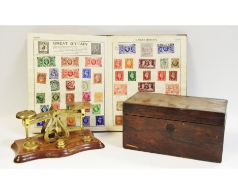 An early 20th century postal scale; George III tea caddy; The Victory school boy stamp album, including penny reds and many e