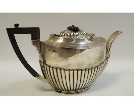 An Edwardian silver teapot by The Alexander Clark Manufacturing Co. 1902 with ebony handle and finial 500g gross 