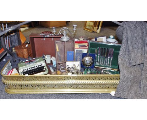 Boxes &amp; objects - An early 20th century fire fender; cased typewriter;  Crombie tweed over coat; canteen of kings pattern