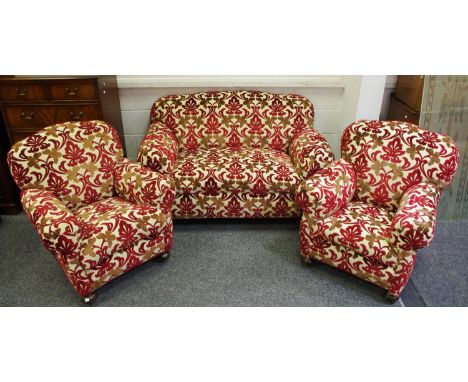 A 1930/40' three piece suite comprising drop arm two seat sofa and two armchairs. (3)