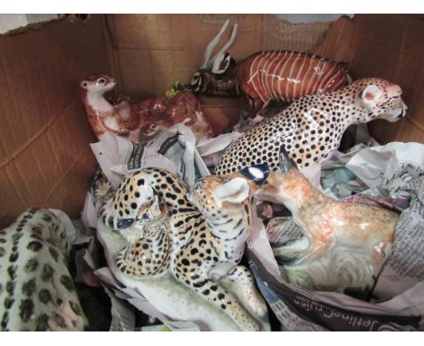 A quantity of Ceramic figures of Snow Leopard, Tiger, Tiger, Lynx, Fox, Otters, Bongo Antelope, Otters and Cheetah