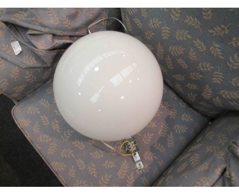 A large white opaque glass circular ceiling light