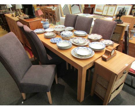 A light oak dining table, rectangular form, on square legs, 180cm long x 90cm wide, and a set of six modern high back chairs,