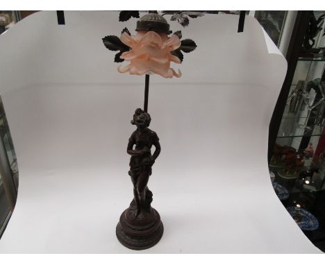 A bronzed figural table lamp with floral shade and a three arm candle lamp