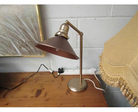 A metal adjustable desk lamp