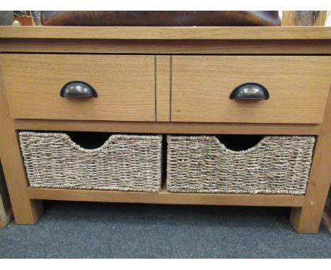 A light oak low side table with twin drawers over twin woven drawers, 80cm wide x 47cm high x 45cm deep