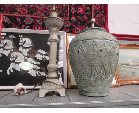 A modern lamp and terracotta lamp base