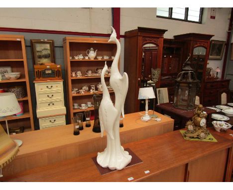A ceramic ornament in the form of a pair of tall, slender birds, approx. 105cm high