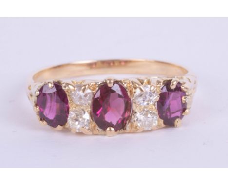 An 18ct Edwardian ruby and diamond set ring, size Q.