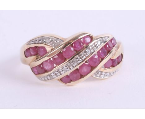 A ruby and diamond set crossover ring, size P.
