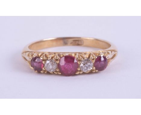 An early 20th century 18ct ruby and diamond five stone ring, set in yellow gold, size M.