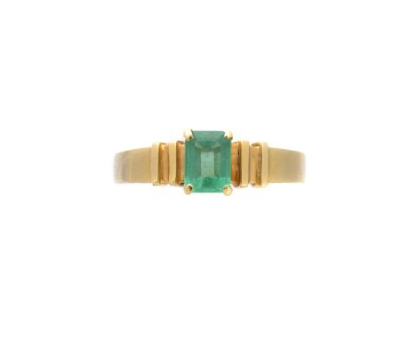 An emerald single stone ring, the rectangular shape emerald with grooved shoulders, stamped 585, ring size L1/2, gross weight