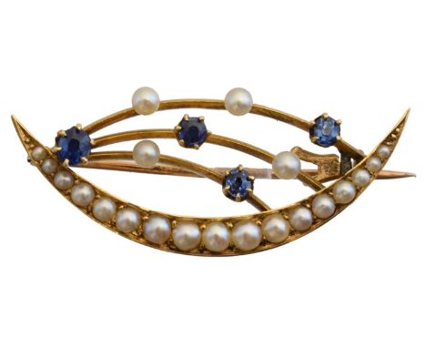 An early 20th century crescent brooch, the split pearl crescent with circular shape sapphire and seed pearl spray accents, st