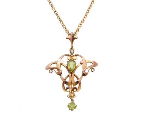 An early 20th century peridot and seed pearl pendant, the vari shape peridot duo within a seed pearl openwork surround, suspe