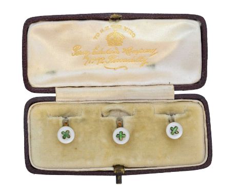 A cased set of early 20th century enamel and mother of pearl dress studs, each designed as a mother of pearl disc with green 