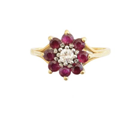 An 18ct gold ruby and diamond cluster ring, the brilliant cut diamond within a circular shape ruby surround, estimated diamon