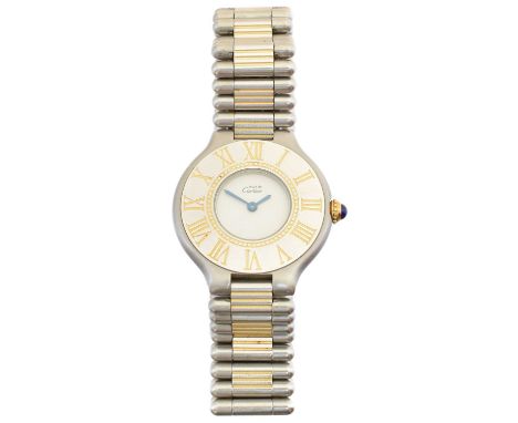 A ladies Must de Cartier quartz watch, the circular signed dial with oversized bi-colour bezel, roman numeral hour markers an