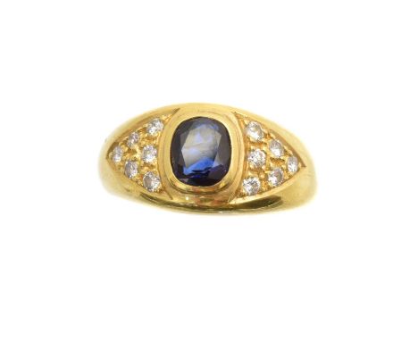 A sapphire and diamond dress ring, the cushion shape sapphire with brilliant cut diamond sides, inset to the polished band, e