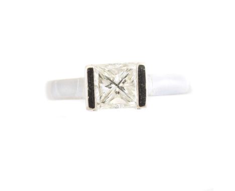 A platinum diamond single stone ring, the princess cut diamond weighing approx. 1ct with raised bar sides, estimated colour H