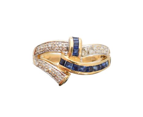 A sapphire and diamond dress ring, of asymmetric design, the square shape sapphire and pavé set diamond bands with tapered sh