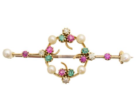 An early 20th century vari gem brooch, designed as a seed pearl, ruby, diamond and emerald wreath with circular shape ruby an