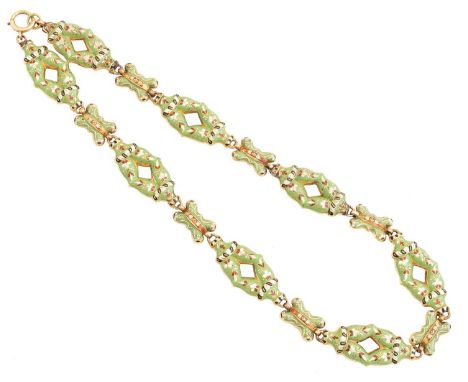 An enamel necklace, the green, red, black and white enamel openwork links with floral detailing and cross spacers, to the bla