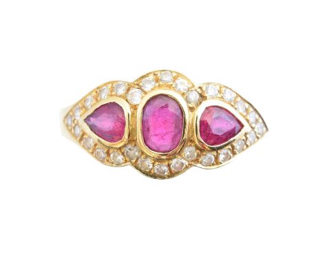 An 18ct gold ruby and diamond cluster ring, the oval and pear shape ruby line within a brilliant cut diamond shared surround,