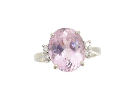 An 18ct gold kunzite and diamond dress ring, the oval shape kunzite with brilliant cut diamond shoulders, hallmarks for Birmi