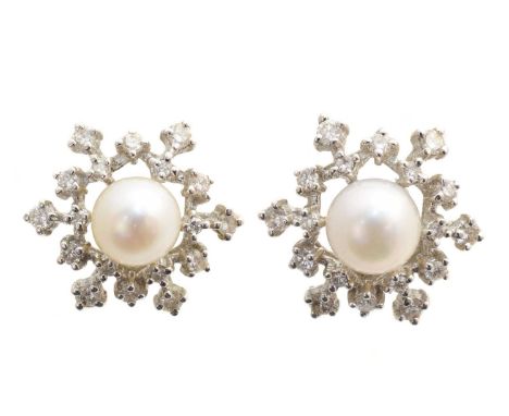 A pair of cultured pearl and diamond earrings, each designed as a cultured pearl within a brilliant cut diamond openwork surr