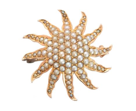 An early 20th century split pearl brooch, designed as a split pearl starburst, may also be worn as a pendant, length 3.2cm, g