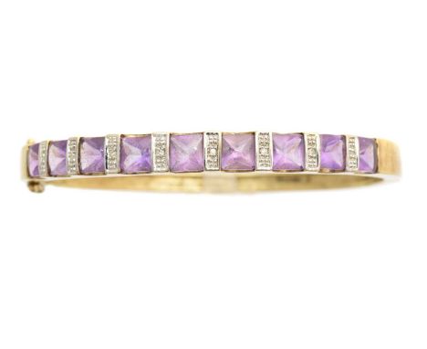 A 9ct gold amethyst and diamond hinged bangle, the square shape amethyst line with single cut diamond bar spacers and plain h
