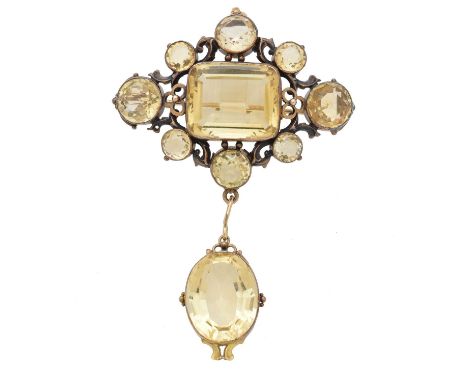 A citrine brooch, the rectangular shape citrine weighing approximately 21cts within a vari size circular shape citrine surrou