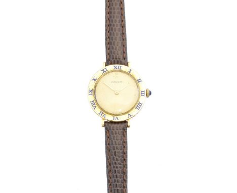 An 18ct gold Corum watch, the signed circular gold-tone dial with maker's logo to 12, blue enamel roman numeral hour markers 