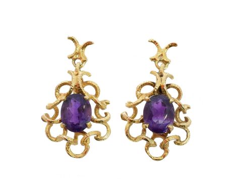A pair of 9ct gold amethyst earrings by Deakin & Francis, each designed as an oval shape amethyst within a textured openwork 