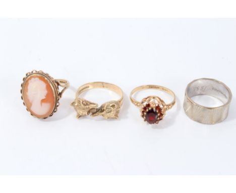 9ct white gold wedding ring, cameo ring, garnet ring and fox-head ring (4) CONDITION REPORT All four rings hallmarked gold (9