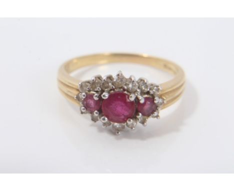 Ladies gold (18ct) ruby and diamond cluster ring