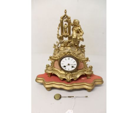 19th century mantel clock with French eight day movement striking on a bell (bell absent), white enamel dial with Roman numer