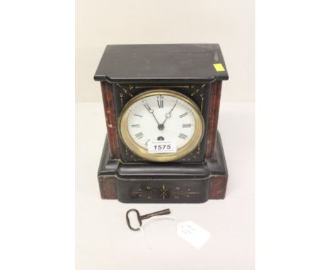 Late 19th century mantel clock with French eight day timepiece movement and white enamel dial with Roman numerals in a black 