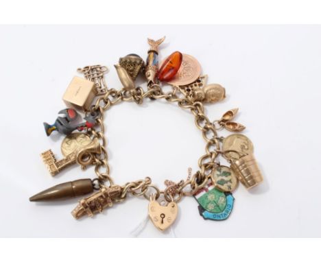 Gold (9ct) charm bracelet with gold, yellow metal and base metal charms CONDITION REPORT Weight 61.7 grams